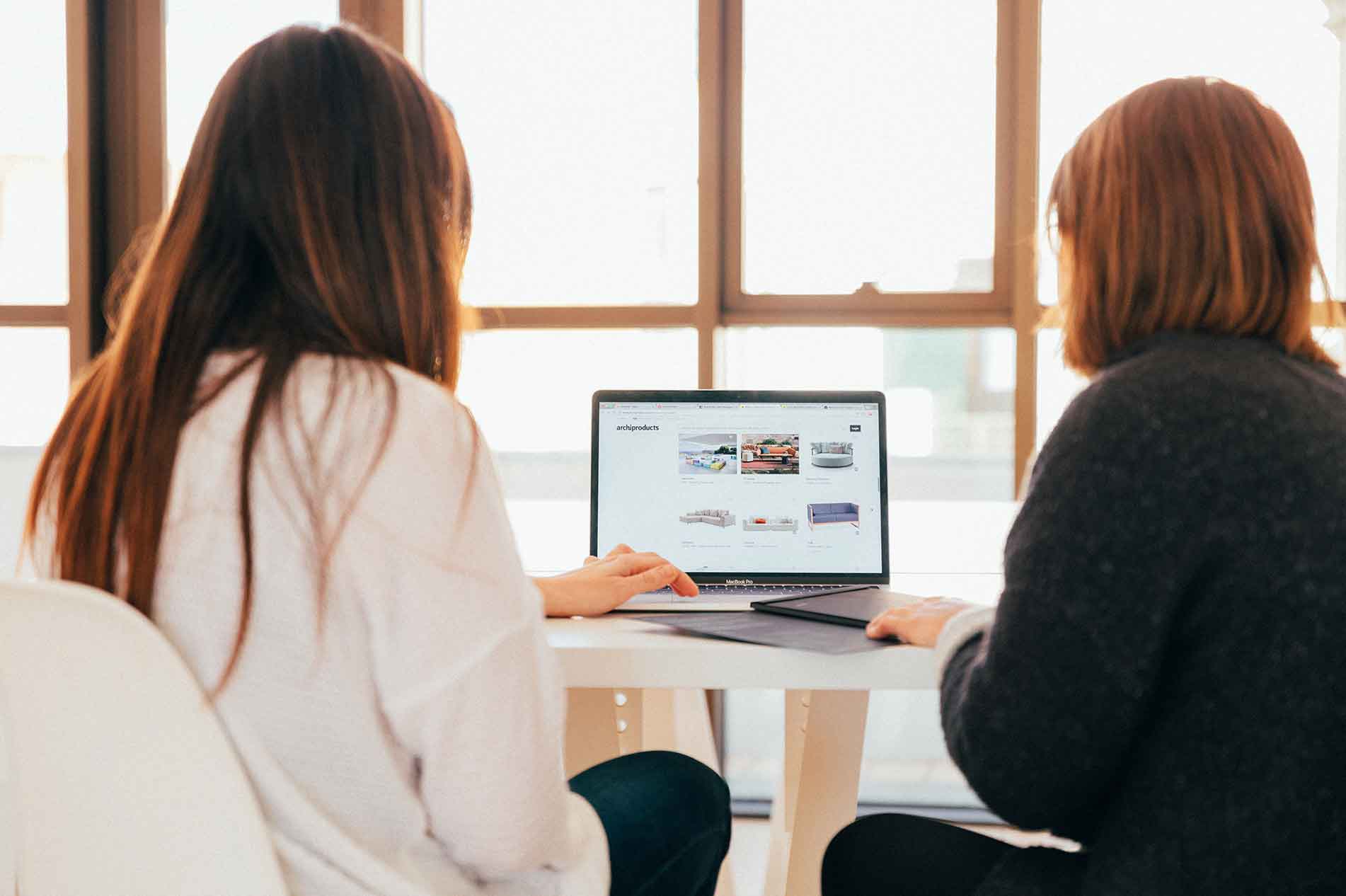 Shot showing women on laptop