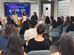Nadia Mojahed of SEO Transformer presenting on AI visibility and digital rights at the Women in Digital Switzerland panel at Spaces Nations Geneva, alongside Azin Tadjdini and Roxane Allot.